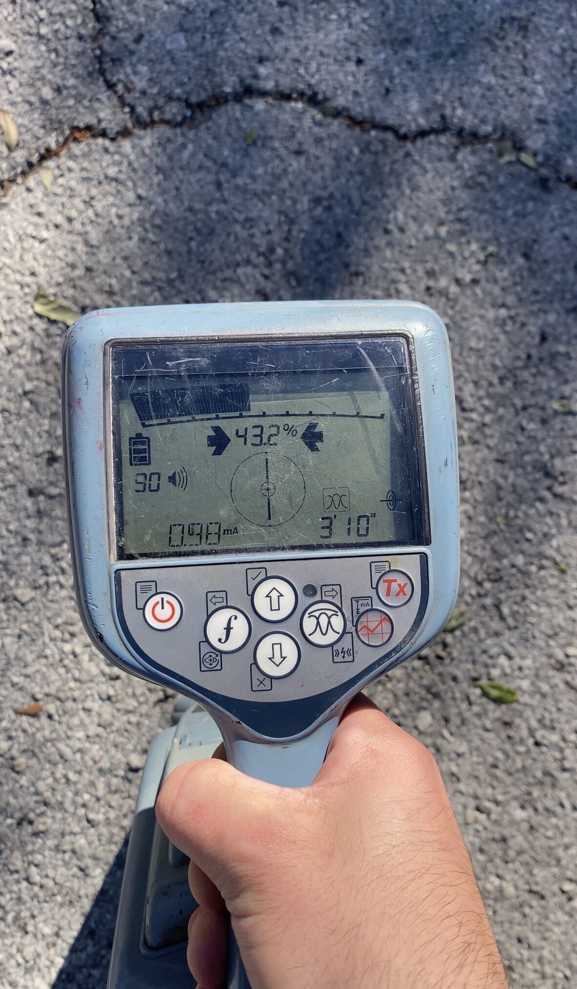 Utility locator displaying an estimated underground depth