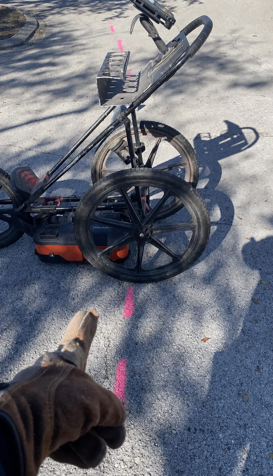 GPR cart scanning along a marked route on pavement